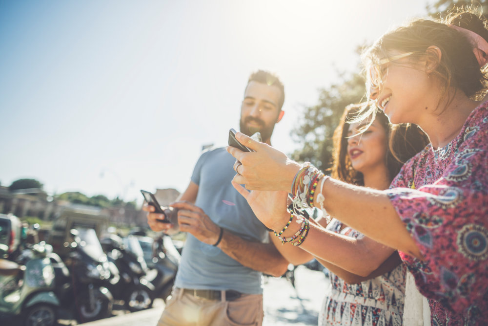 students taking 5g training courses on their phones
