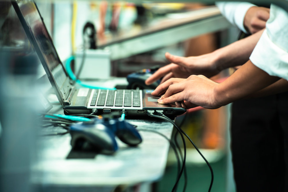 conducting QXDM log analysis on a laptop in a lab