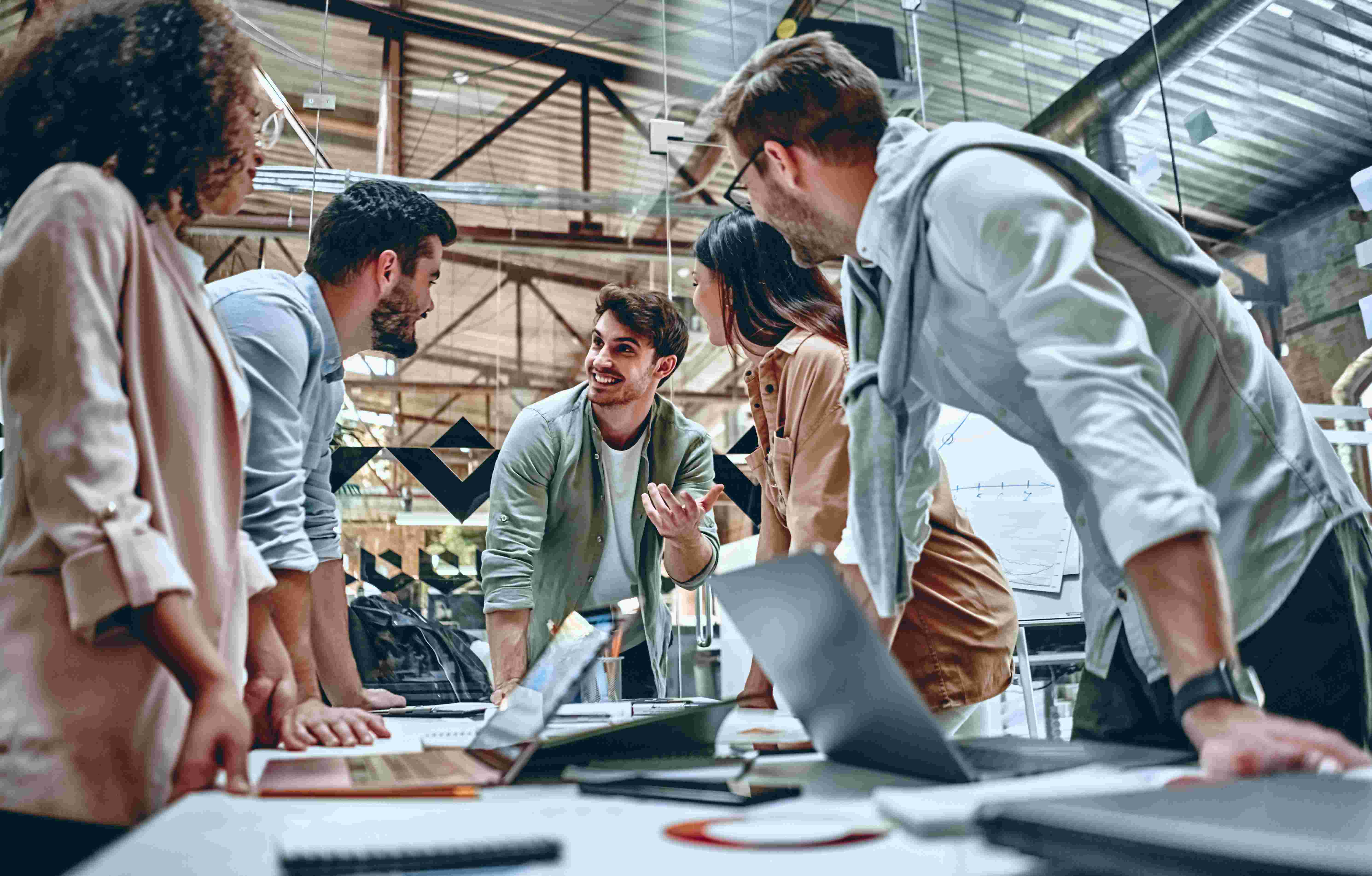 young people at a startup working at a desk